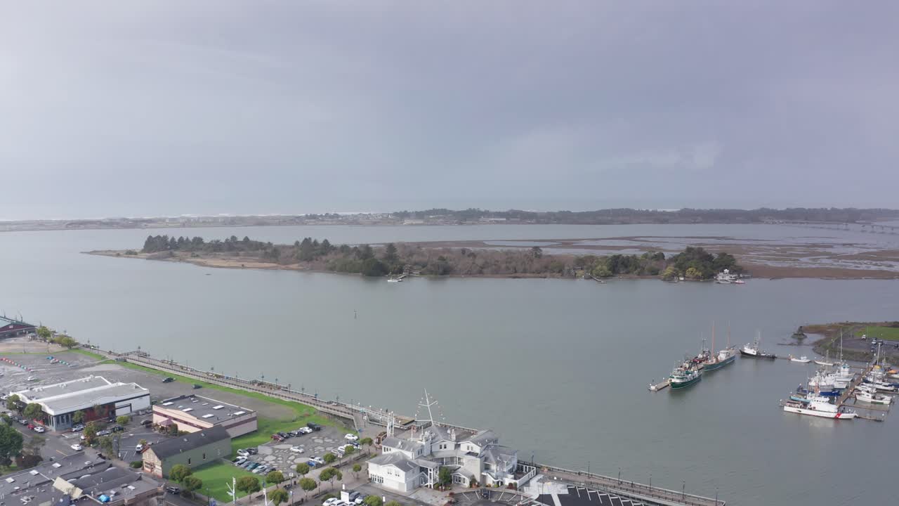 Aerial wide rising shot of Samoa Channel and Tuluwat Island in Humbolt Bay along the coast of Eureka, California. 4K