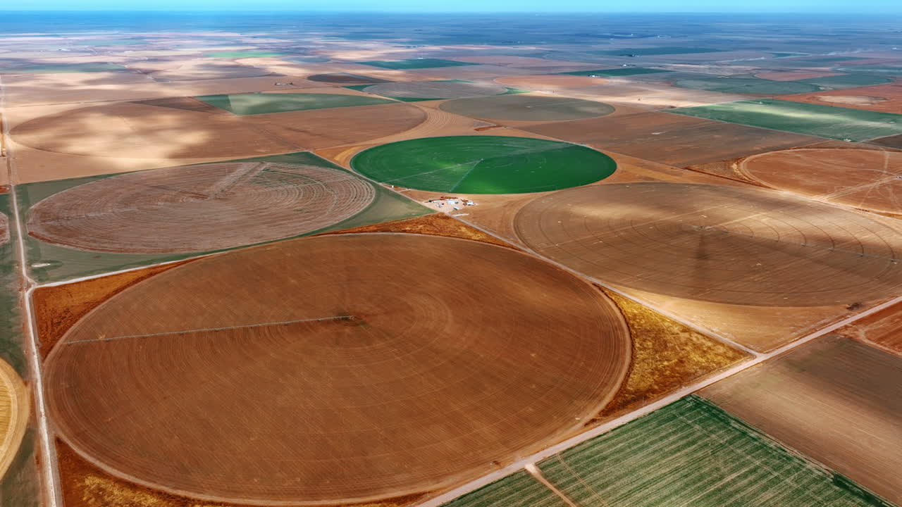 Ground prepared for planting or sowing seeds on the circular farms in the vast plantations. Agricultural fields in the deserted areas. Top view.