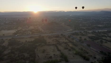 aerial-view-of-Remains-of-the-ancient-city-of-Teotihuacan-with-sun-behind-ate-golden-hour-time,-Mexico