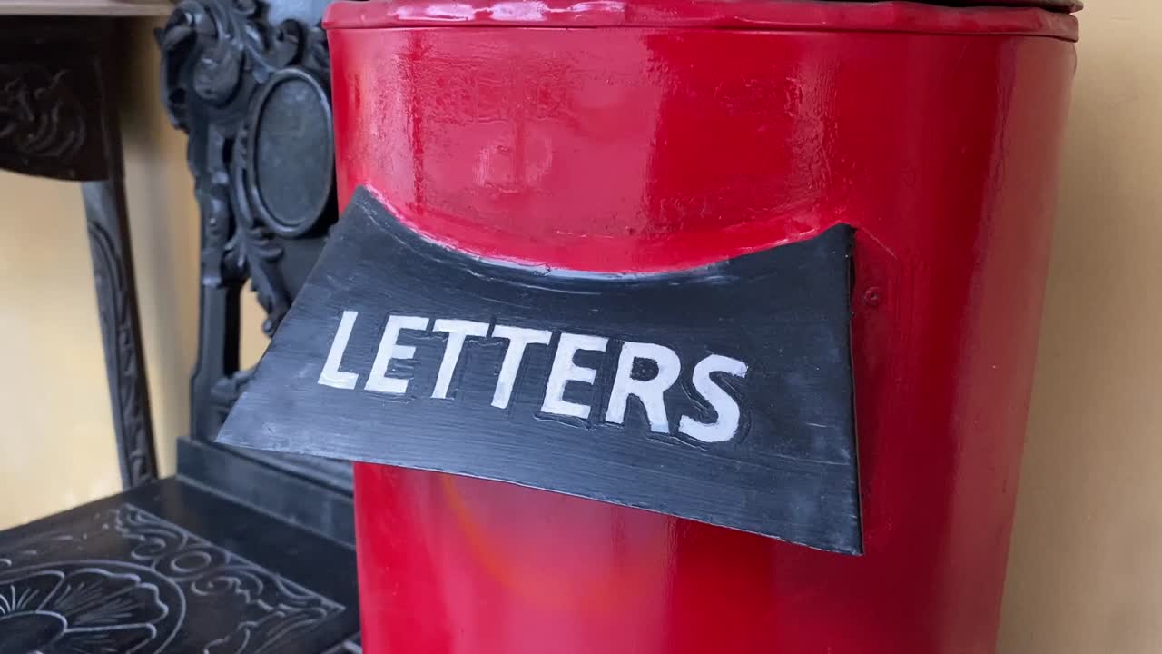 Red colored post box of Indian Post&amp;quot; with Letters written in it