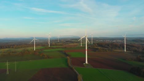 drone-flight-over-wind-turbine-park-in-a-rural-landscape