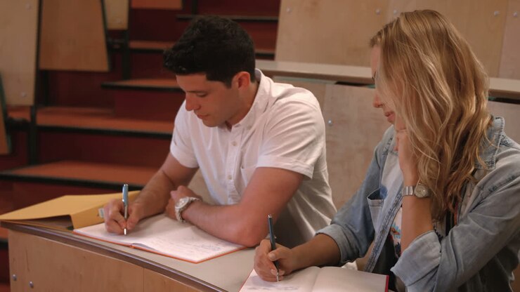 Students taking notes in lecture
