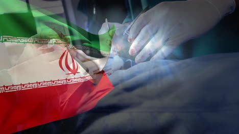 In hospital, animation of Iranian flag over medical professionals performing surgery