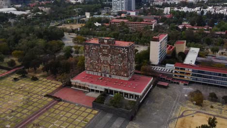 building with artistic mural on unam campus, mexico city, mexico