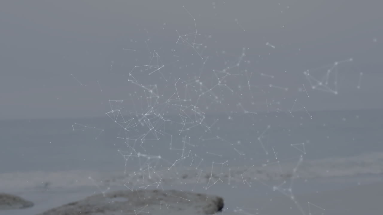 Animation of white lines and nodes over calm ocean background, creating network