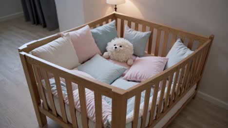 baby crib with pillows and soft toys