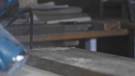 workshop blowing dust wood woodworker slow motion