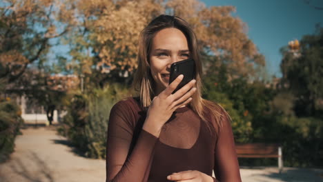 young woman using smartphone outdoors.