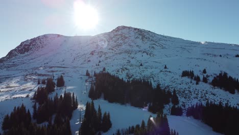 Shot-of-a-busy-ski-resort-with-skiers-and-snowboarders-on-a-long-mountain-slope-near-Sofia,-Bulgaria