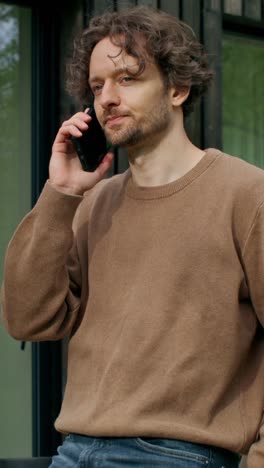 man talking on the phone outdoors