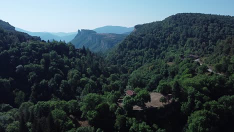 Hidden-village-among-trees-in-the-mountains-of-Catalonia,-Spain