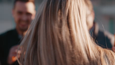 group-of-diverse-friends-hanging-out-beautiful-blonde-woman-dancing-enjoying-rooftop-party-at-sunset-drinking-alcohol-having-fun-on-weekend-celebration