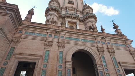 featuring intricate tilework and grand archways, the plaza de espana in seville showcases stunning moorish revival architecture. tilt up