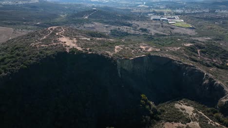 Slow-motion-high-aerial-shot-of-the-Calavera-hills---a-community-in-Carlsbad-California,-the-northern-part-of-San-Deigo,-area-offers-6+-miles-of-dirt-biking-and-hiking-trails