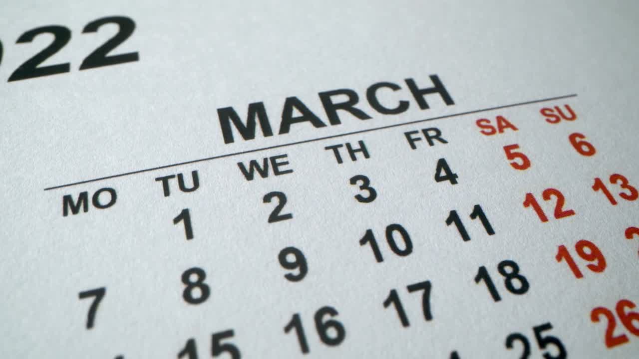Calendar with an important event for 8 March, International Women's Day. 2022 year. Macro shot of dates in Marh. Holidays and business days in new year