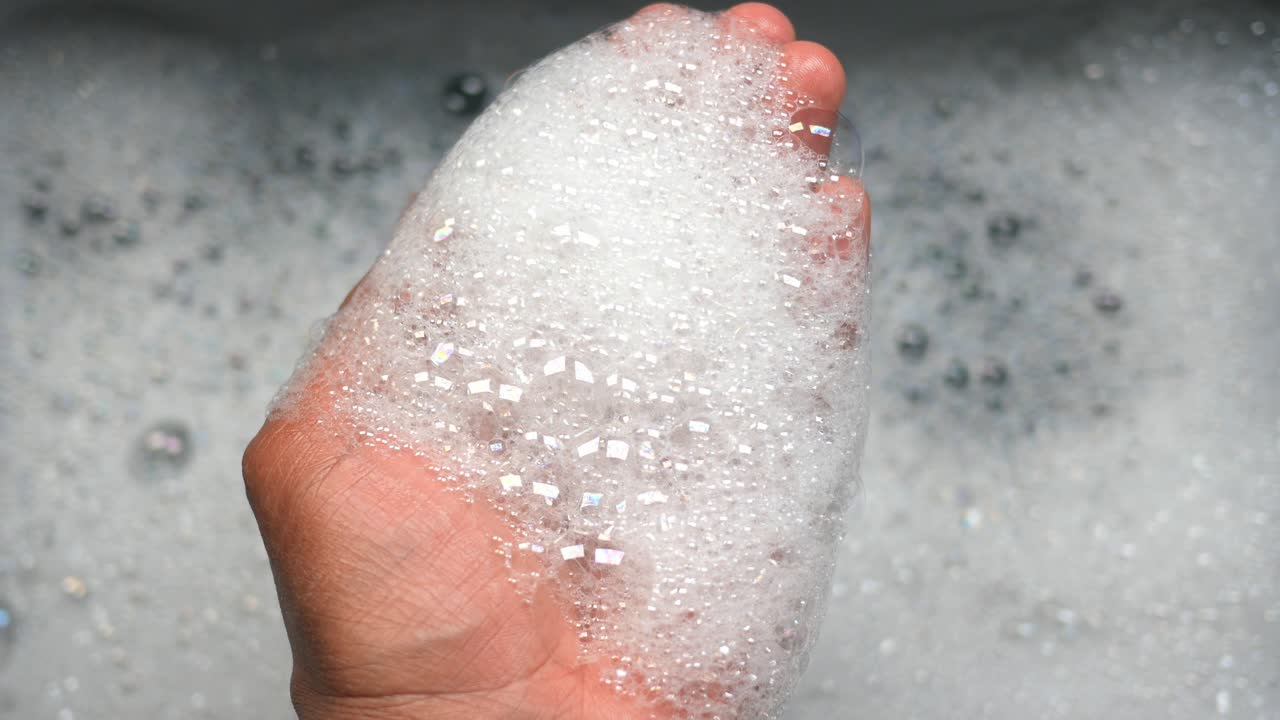 Hand Covered in Soap Suds
