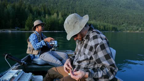 two fishermen preparing for fishing in the boat 4k