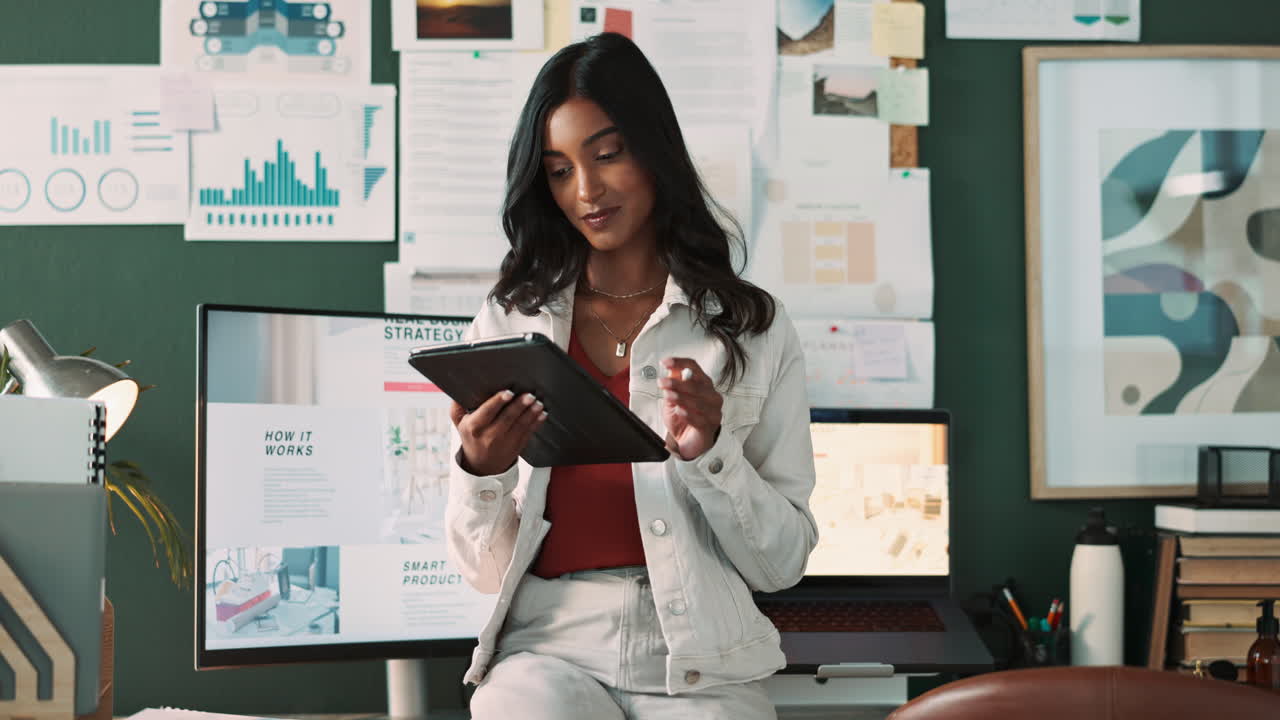 Professional woman working on a tablet in her office
