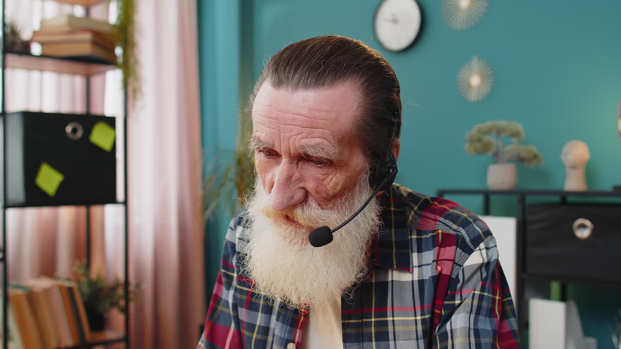 Senior businessman wearing headset freelance worker call center or support service operator helpline