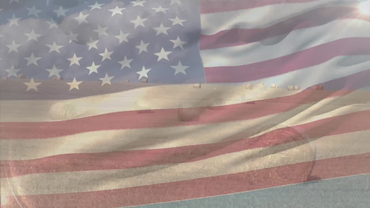 composición digital de la bandera estadounidense ondeando contra la vista del paisaje del campo de la granja