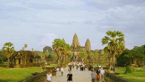 tourists walking to angkor wat temple siem reap, cambodia