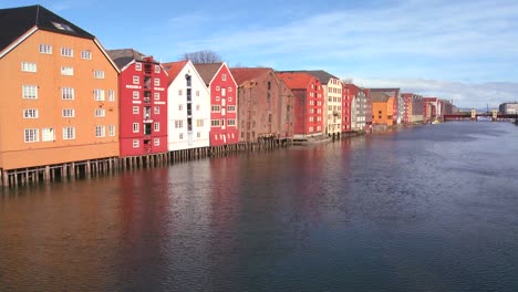 colorful wooden buildings line the waterfront of trondheim norway 5