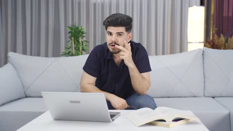 Young-man-curiously-hearing-good-news-from-camera.