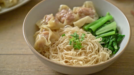 dried egg noodles with pork wonton or pork dumplings without soup asian food style