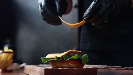 chef preparing a cheeseburger