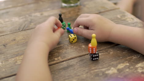 child playing with dice and counters