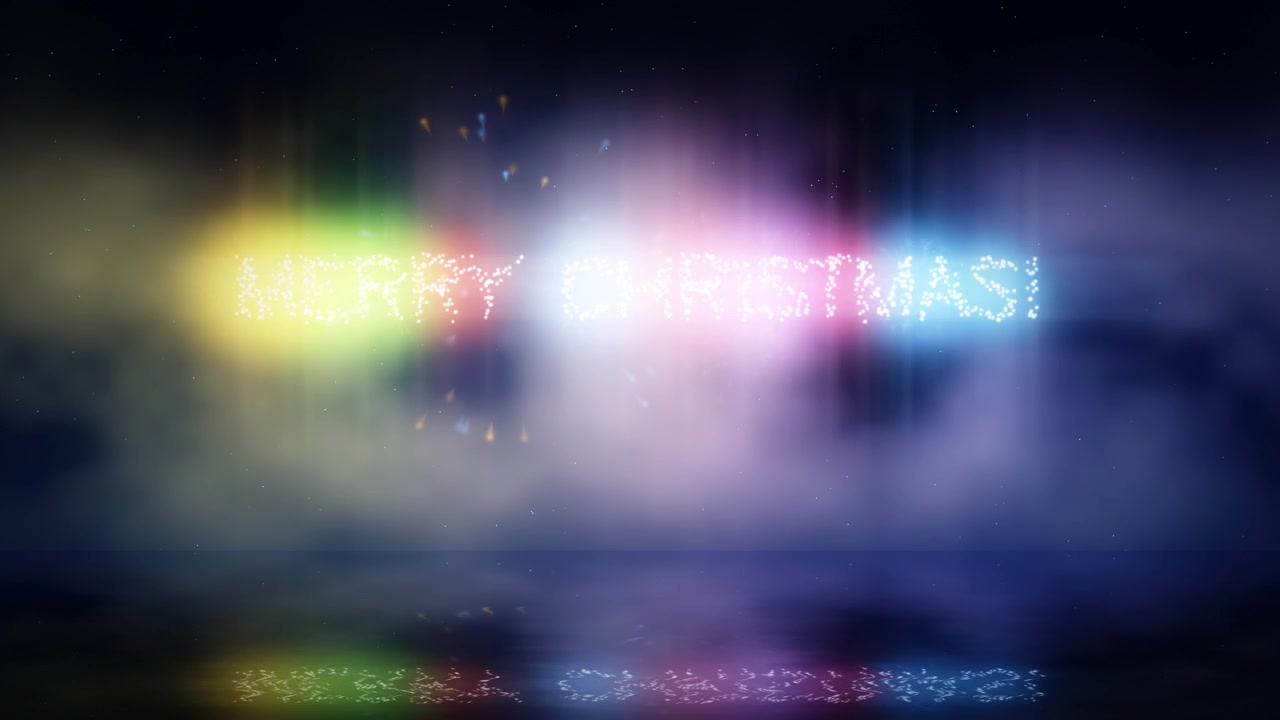Fuochi d'artificio vivaci formano le parole Buon Natale nel cielo notturno scuro, riflettendosi magnificamente sull'oceano tranquillo durante una celebrazione gioiosa.