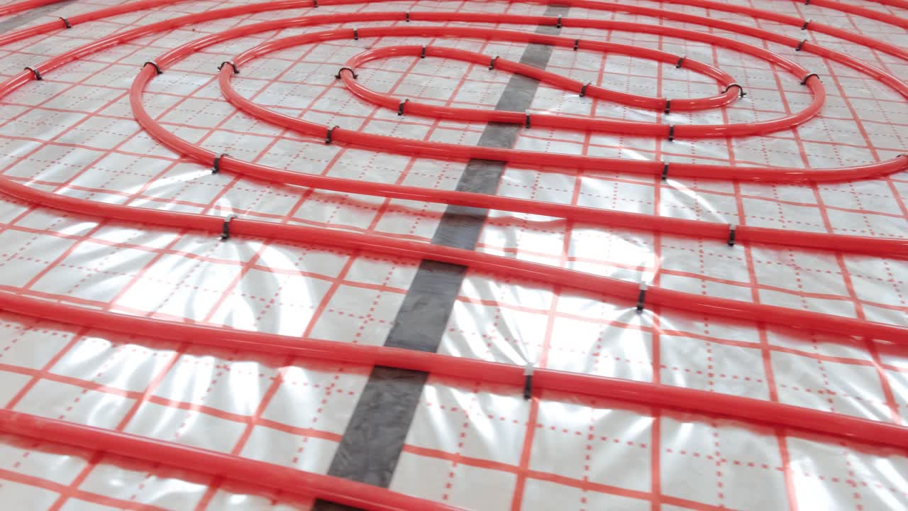 Installing underfloor heating pipes for water heating. Heating systems. Pipes for a heat-insulated floor.