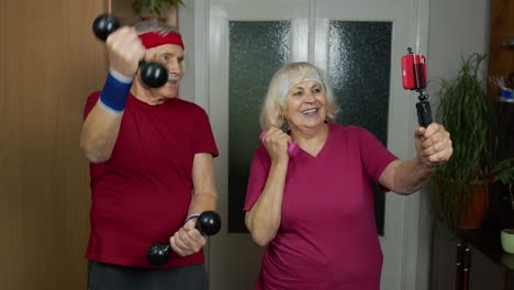 Senior-elderly-couple-grandmother-grandfather-doing-workout-with-dumbbells,-fitness-exercising