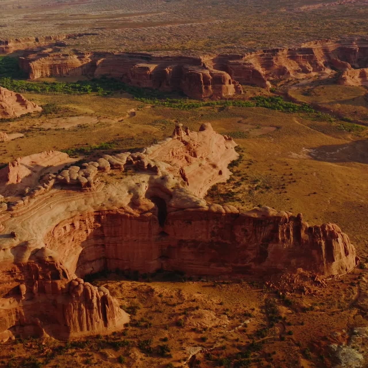 Arches canyons in Utah, USA. Amazing landscape of huge rocks in the rays of bright sun. Aerial view