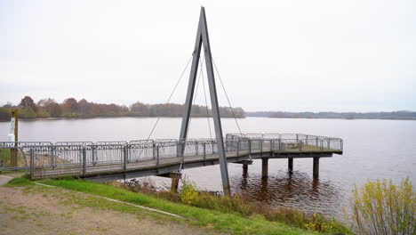 empty bridge by soeste river with clear sky in friesoythe, germany