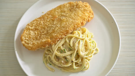 homemade spaghetti pasta white cream sauce with fried fish