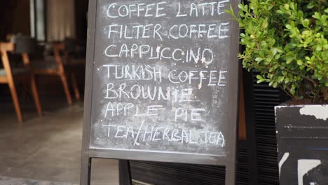 cafe menu board with various drinks and desserts