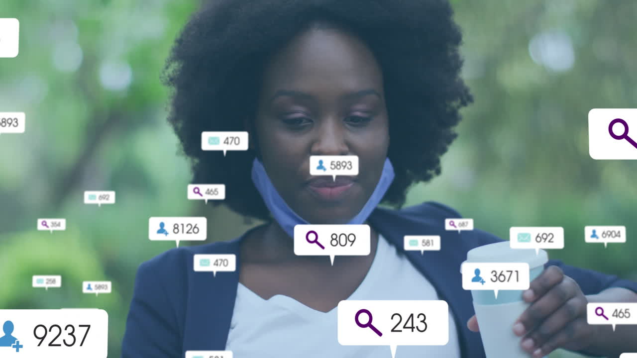 Animation of media notifications over happy african american woman with mask drinking coffee