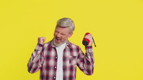 happy man dancing with portable speaker joyful freedom musical expression groove listening music