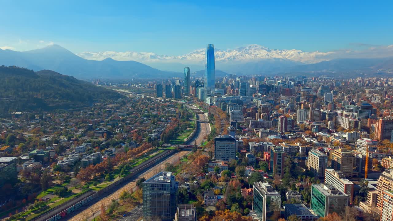 Mapocho river runs alongside downtown Santiago with skyscrapers alongside