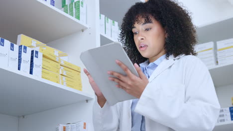 pharmacist typing online inventory on a digital