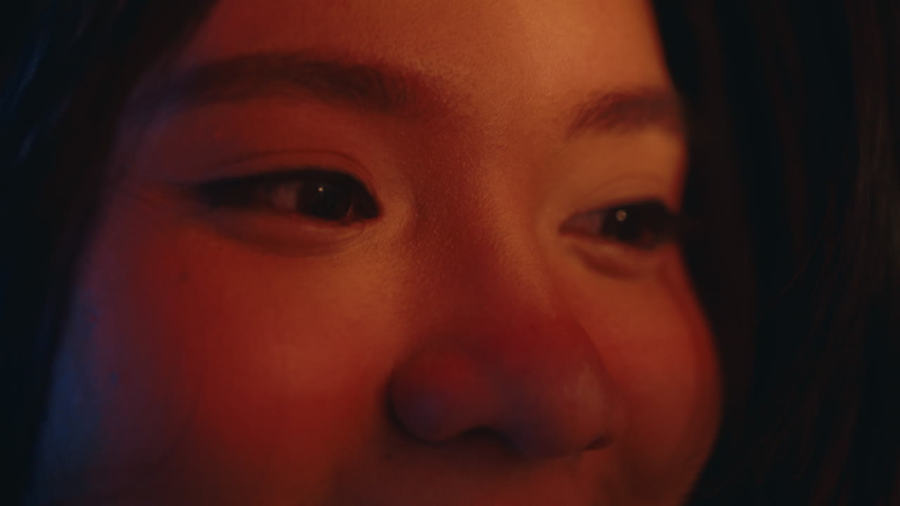 Close-up of a woman's face at night