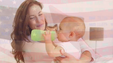 animation of flag of usa waving over happy caucasian mother playing with baby