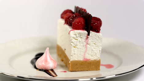 cheesecake rotates on the turntable on a white background