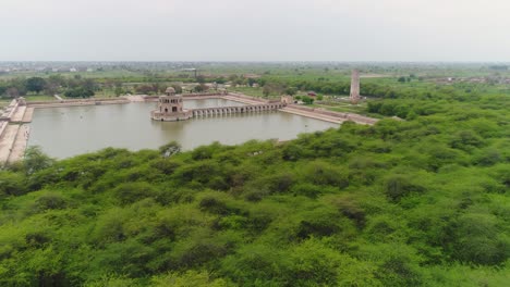 aerial flyover of hiran minar, sandstone tower and architecture in punjabi, pakistan