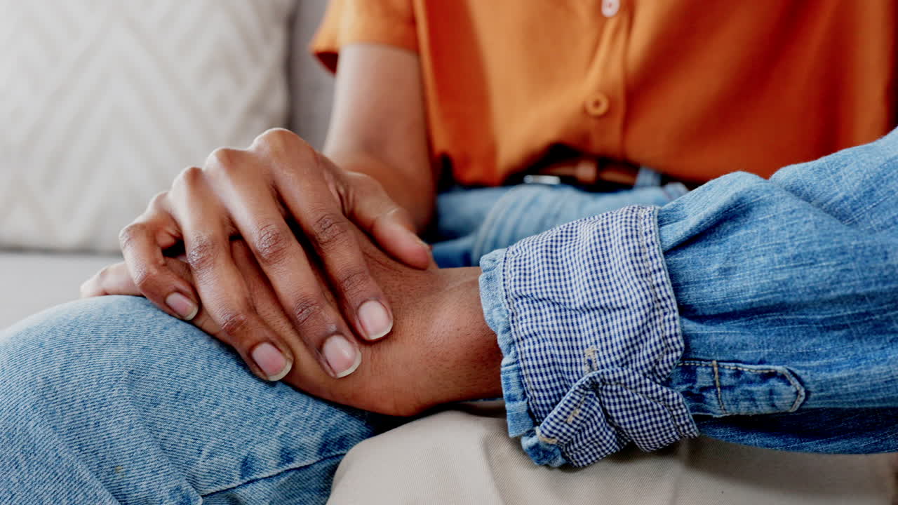 Love, support and couple holding hands to show