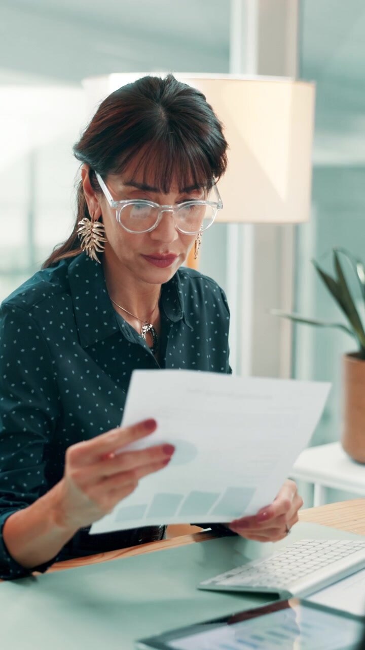 Professional Woman Working at Desk in Modern Office