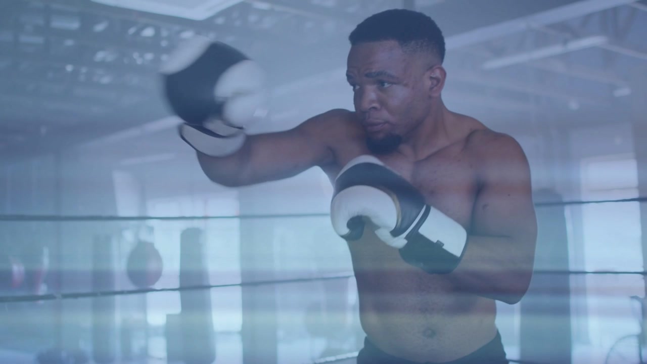 Boxer extending left jab, tightening guard, slipping by ropes, moving into boxing combos, training