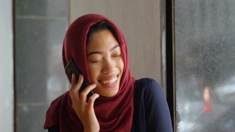 female executive talking on mobile phone in office 4k