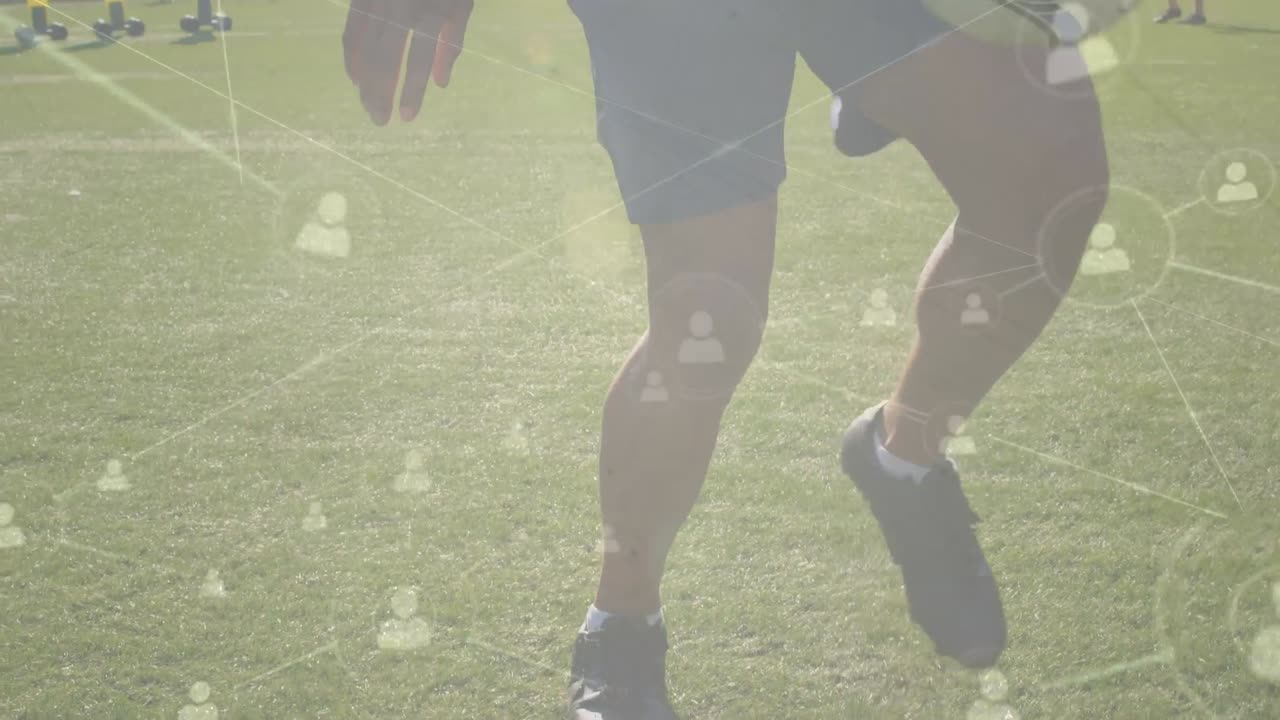 Animation of data processing over caucasian male soccer player kicking ball